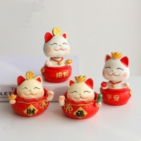 Mèo thần tài lắc đầu